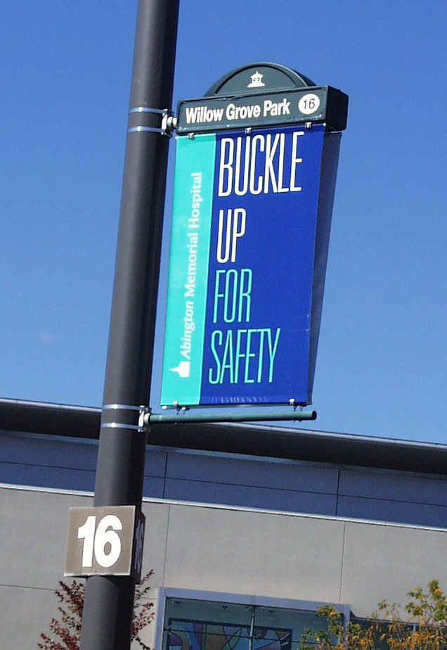 Lumen Banner displayed in a parking lot.